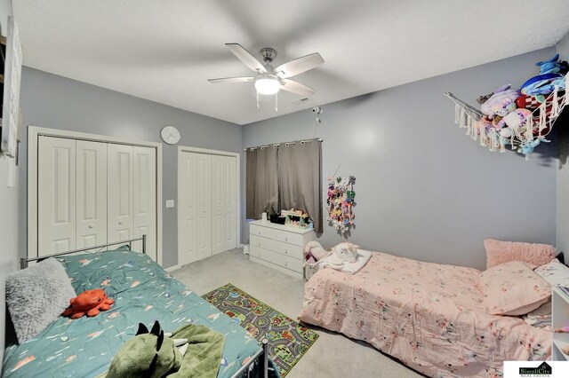 1946 Eastgate Dr, Crete, NE 68333 - carpeted bedroom featuring two closets and ceiling fan