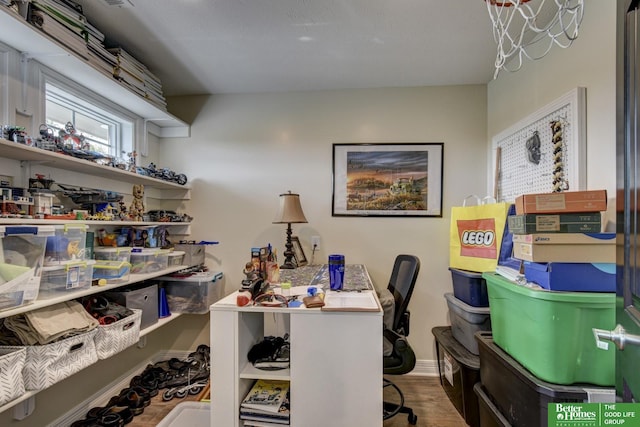 office area featuring wood finished floors and baseboards