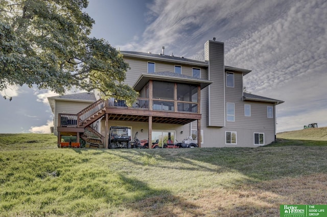 back of house with a sunroom, a chimney, stairs, a wooden deck, and a yard