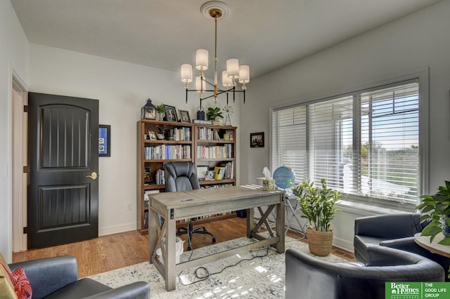 office with a chandelier, baseboards, and wood finished floors