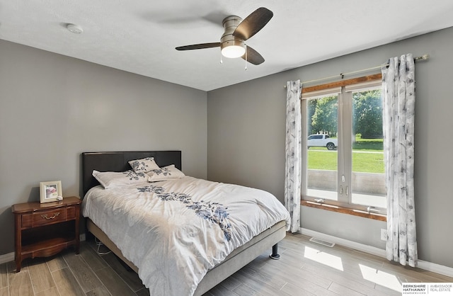 17819 Nicholas Rd, Plattsmouth, NE 68048 - bedroom featuring wood finished floors, baseboards, and a ceiling fan