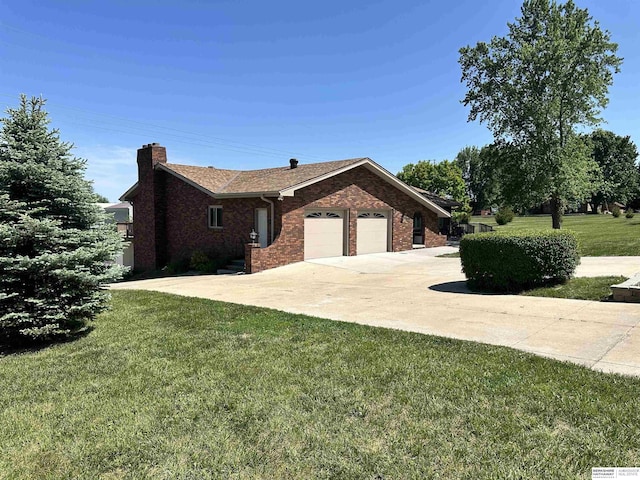 17819 Nicholas Rd, Plattsmouth, NE 68048 - view of side of home featuring brick siding, an attached garage, a yard, concrete driveway, and a chimney