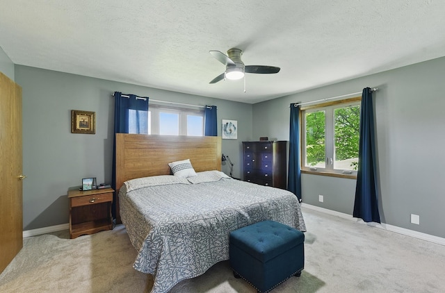 17819 Nicholas Rd, Plattsmouth, NE 68048 - carpeted bedroom featuring baseboards, a ceiling fan, and a textured ceiling
