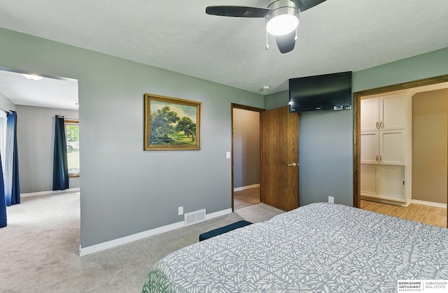 17819 Nicholas Rd, Plattsmouth, NE 68048 - bedroom featuring baseboards, light colored carpet, and ceiling fan