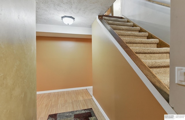17819 Nicholas Rd, Plattsmouth, NE 68048 - staircase with wood finished floors and baseboards