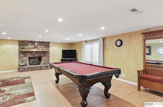 17819 Nicholas Rd, Plattsmouth, NE 68048 - recreation room featuring recessed lighting, wood finished floors, baseboards, billiards table, and a brick fireplace