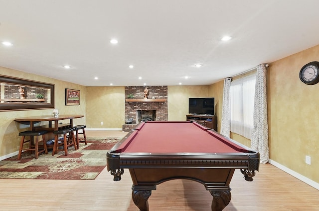 17819 Nicholas Rd, Plattsmouth, NE 68048 - playroom with baseboards, wood finished floors, recessed lighting, a fireplace, and pool table