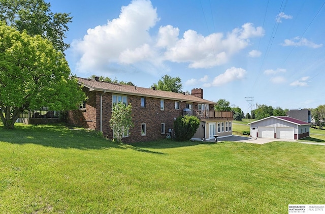 17819 Nicholas Rd, Plattsmouth, NE 68048 - back of property with a garage, a chimney, brick siding, and a lawn