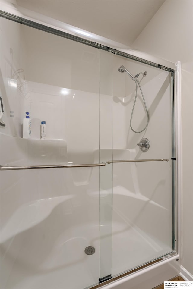 bathroom featuring a shower stall