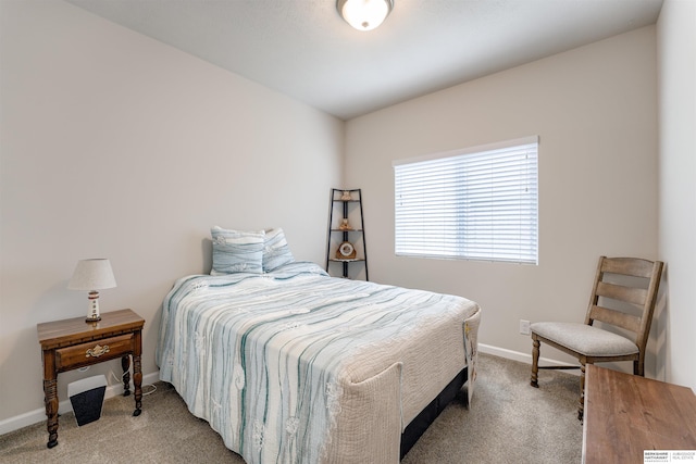 bedroom with carpet and baseboards