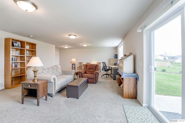 living room featuring light carpet