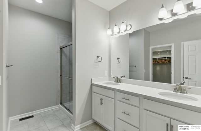 10280 S 209th St, Gretna, NE 68028 - bathroom with baseboards, a stall shower, marble look tile flooring, and double vanity