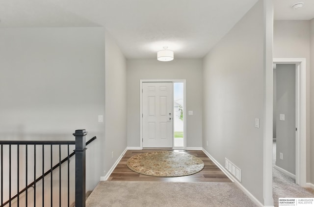 10280 S 209th St, Gretna, NE 68028 - carpeted foyer with baseboards and wood finished floors