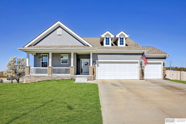2310 Acorn Dr, Plattsmouth, NE 68048 - view of front of property with a garage, covered porch, driveway, and roof with shingles
