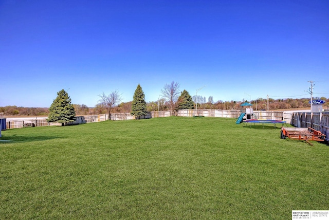2310 Acorn Dr, Plattsmouth, NE 68048 - view of yard with a trampoline and a playground