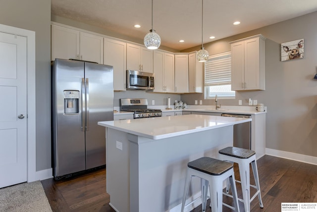 2310 Acorn Dr, Plattsmouth, NE 68048 - kitchen with appliances with stainless steel finishes, a sink, dark wood finished floors, baseboards, and recessed lighting