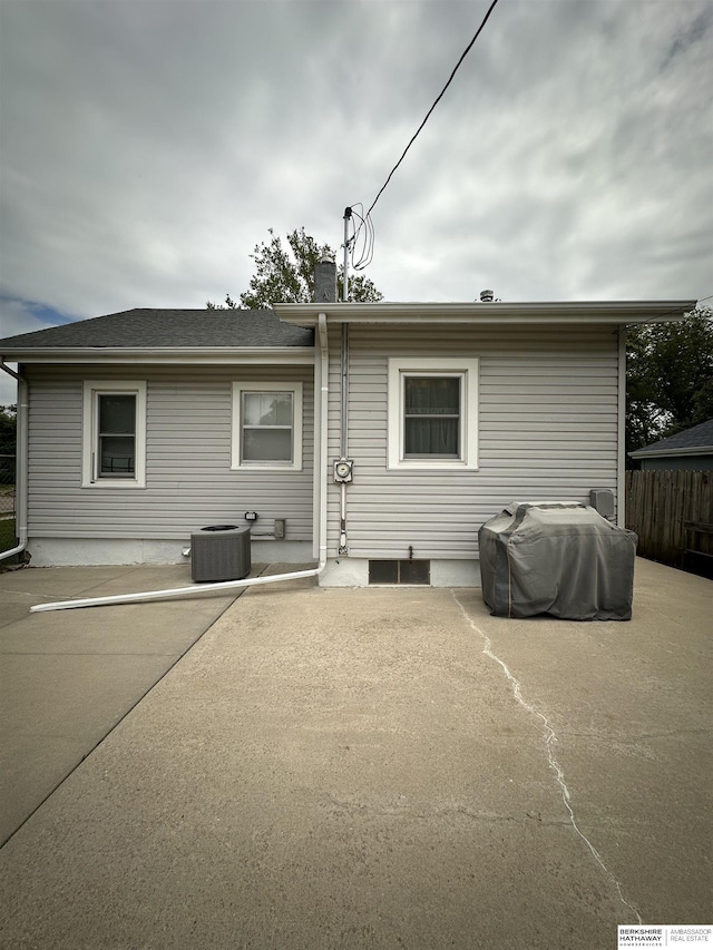 2002 Warren St, Bellevue, NE 68005 - rear view of house featuring a patio and cooling unit