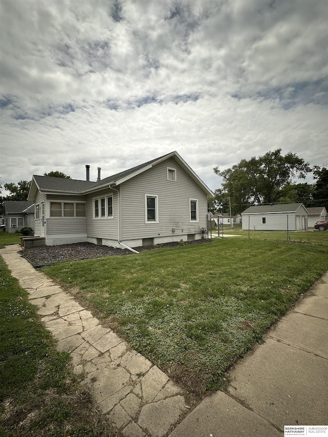 2002 Warren St, Bellevue, NE 68005 - view of home's exterior featuring a lawn