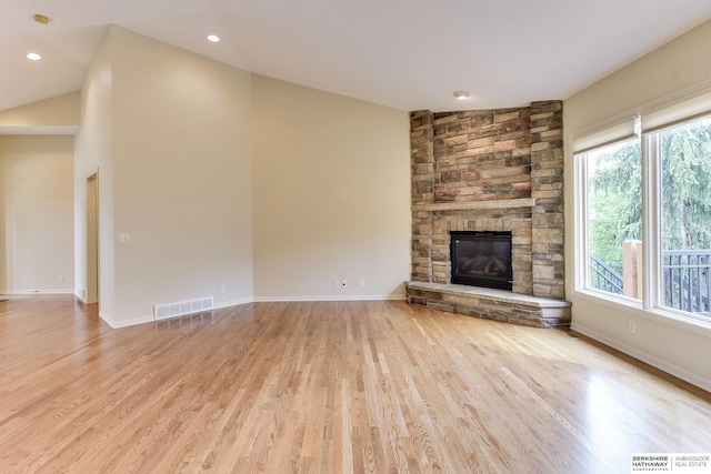 1414 S 189th Ct, Omaha, NE 68130 - unfurnished living room featuring a fireplace, light wood-style flooring, baseboards, and recessed lighting