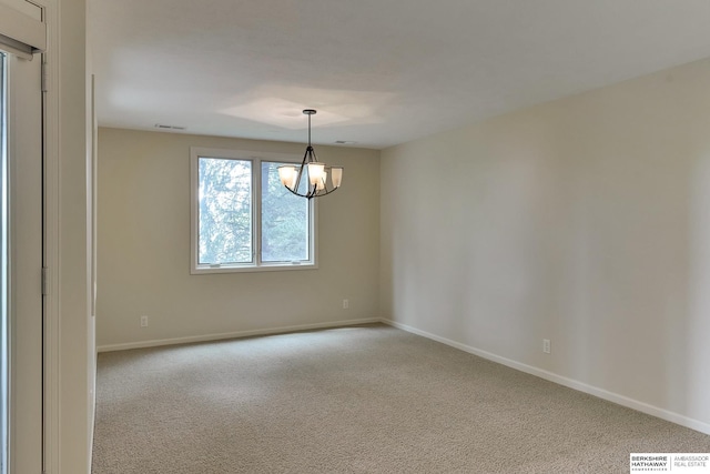 1414 S 189th Ct, Omaha, NE 68130 - empty room featuring a chandelier, carpet flooring, and baseboards