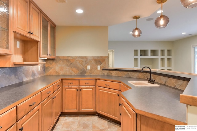 1414 S 189th Ct, Omaha, NE 68130 - kitchen with a sink, backsplash, dark countertops, recessed lighting, and a peninsula