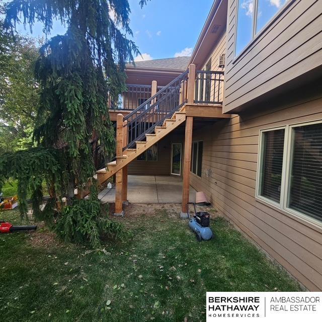 1414 S 189th Ct, Omaha, NE 68130 - exterior space with stairway, a patio area, a yard, and a wooden deck