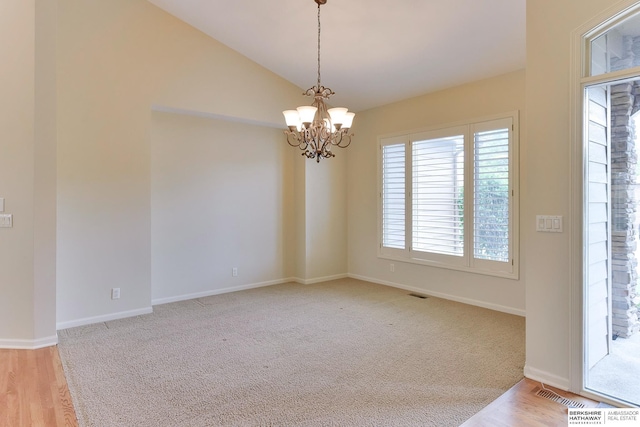 1414 S 189th Ct, Omaha, NE 68130 - unfurnished room with a chandelier, vaulted ceiling, baseboards, light wood finished floors, and light carpet