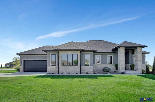 8947 Himark Ln, Lincoln, NE 68526 - prairie-style home with stone siding, roof with shingles, concrete driveway, and an attached garage