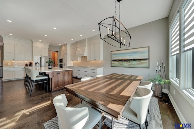 8947 Himark Ln, Lincoln, NE 68526 - dining room featuring a chandelier, dark wood-style flooring, baseboards, and recessed lighting