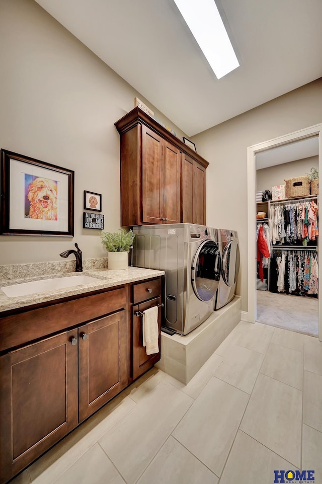 8947 Himark Ln, Lincoln, NE 68526 - laundry area with cabinet space, independent washer and dryer, and light tile patterned floors