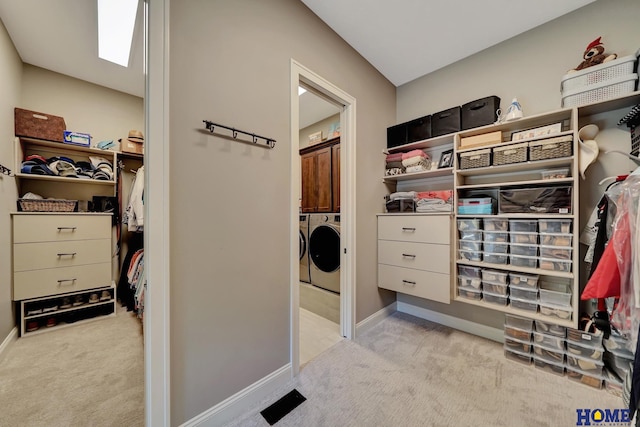 8947 Himark Ln, Lincoln, NE 68526 - walk in closet with light colored carpet and washing machine and clothes dryer
