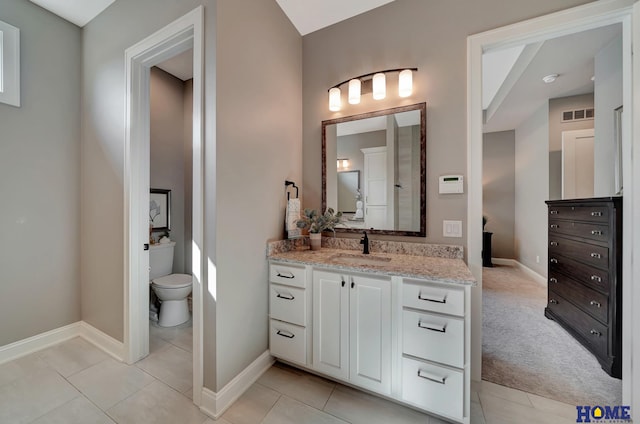 8947 Himark Ln, Lincoln, NE 68526 - bathroom featuring vanity, baseboards, and tile patterned floors