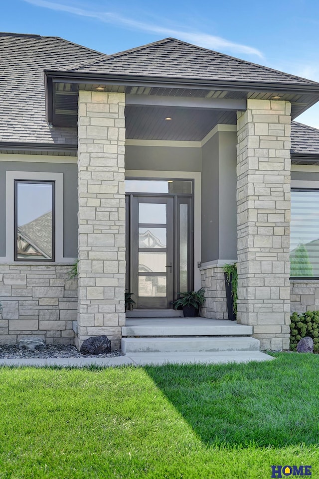 8947 Himark Ln, Lincoln, NE 68526 - doorway to property with a yard, stucco siding, and stone siding
