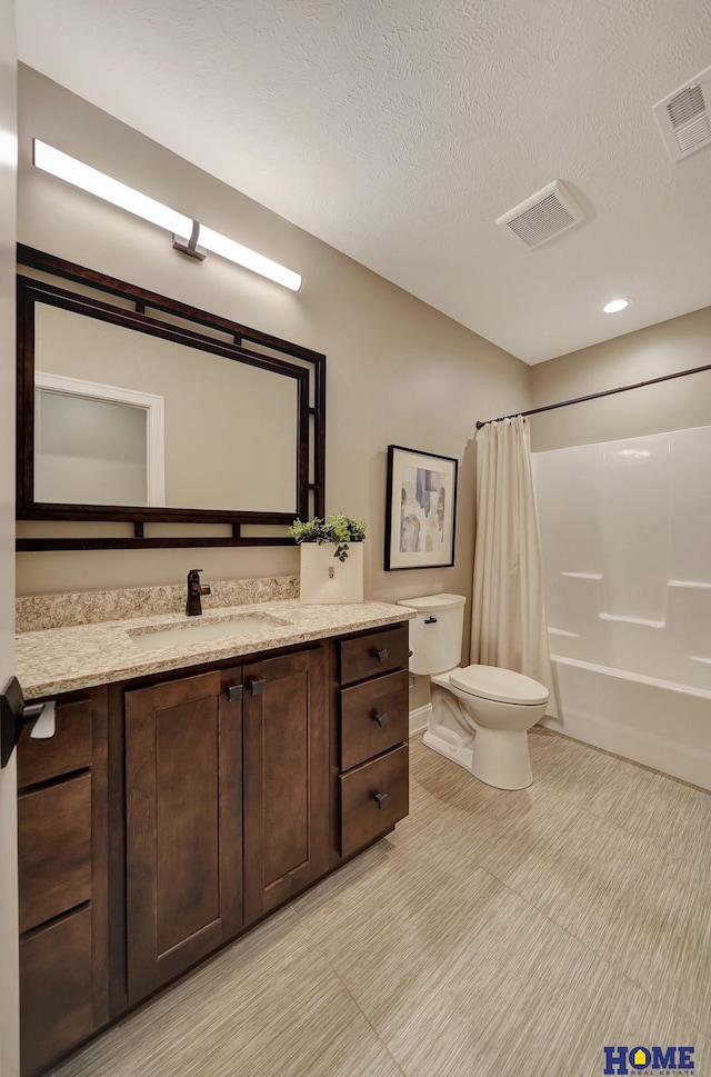 8947 Himark Ln, Lincoln, NE 68526 - full bathroom featuring toilet, vanity, shower / tub combo, tile patterned floors, and a textured ceiling