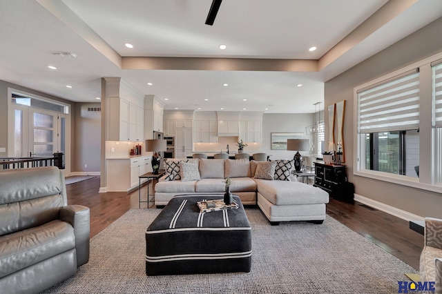 8947 Himark Ln, Lincoln, NE 68526 - living area with dark wood finished floors, recessed lighting, and baseboards