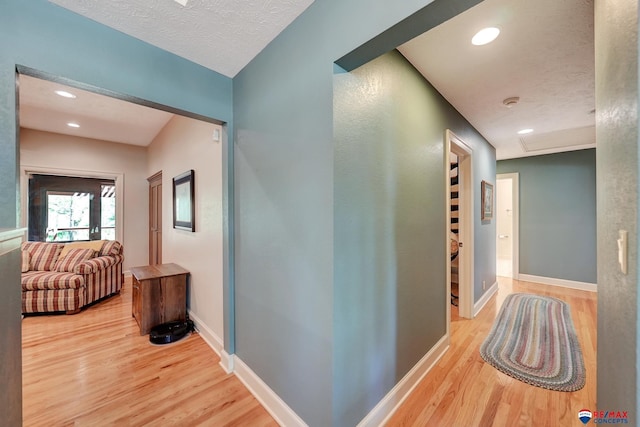 9900 Van Dorn St, Lincoln, NE 68520 - hall with wood finished floors, baseboards, recessed lighting, and a textured ceiling