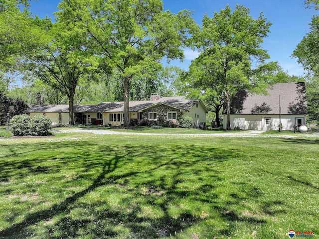 9900 Van Dorn St, Lincoln, NE 68520 - view of front of home with a chimney and a front lawn