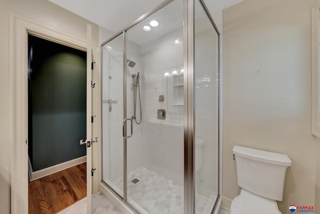 9900 Van Dorn St, Lincoln, NE 68520 - full bath with wood finished floors, a stall shower, and toilet