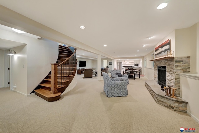 9900 Van Dorn St, Lincoln, NE 68520 - living area featuring light colored carpet, stairs, recessed lighting, baseboards, and a fireplace