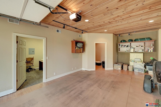9900 Van Dorn St, Lincoln, NE 68520 - garage with a garage door opener, electric panel, a desk, recessed lighting, and wooden ceiling