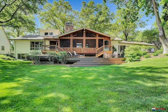 9900 Van Dorn St, Lincoln, NE 68520 - rear view of property featuring a chimney, a sunroom, a wooden deck, and a yard