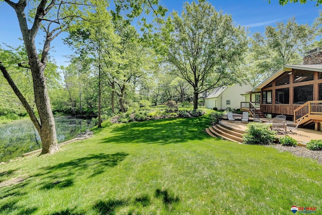 9900 Van Dorn St, Lincoln, NE 68520 - view of green lawn featuring a deck and a sunroom