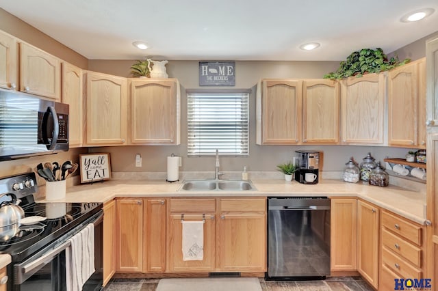 2222 SW Soukup Dr, Lincoln, NE 68522 - kitchen featuring stainless steel appliances, light brown cabinets, a sink, light countertops, and recessed lighting