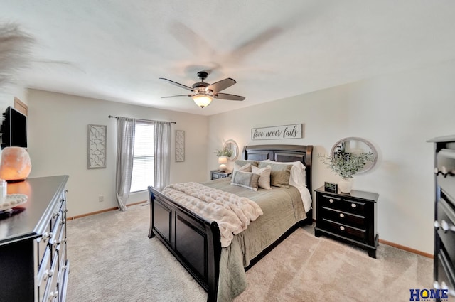 2222 SW Soukup Dr, Lincoln, NE 68522 - bedroom featuring baseboards, light colored carpet, and ceiling fan
