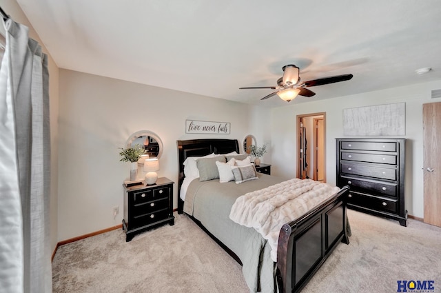 2222 SW Soukup Dr, Lincoln, NE 68522 - bedroom with light colored carpet, baseboards, and a ceiling fan