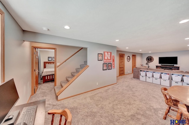 2222 SW Soukup Dr, Lincoln, NE 68522 - carpeted living area with recessed lighting, stairway, and baseboards