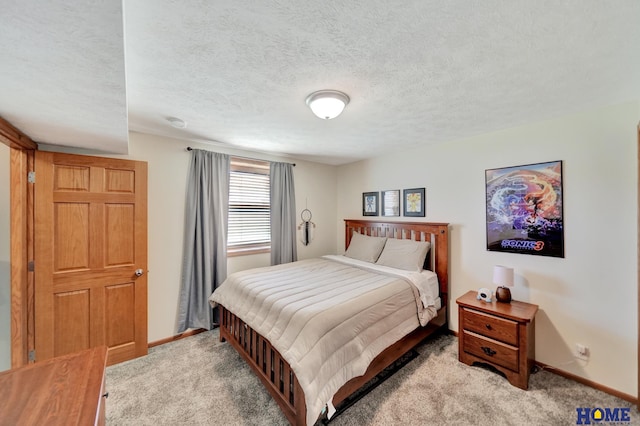 2222 SW Soukup Dr, Lincoln, NE 68522 - bedroom with light colored carpet, baseboards, and a textured ceiling