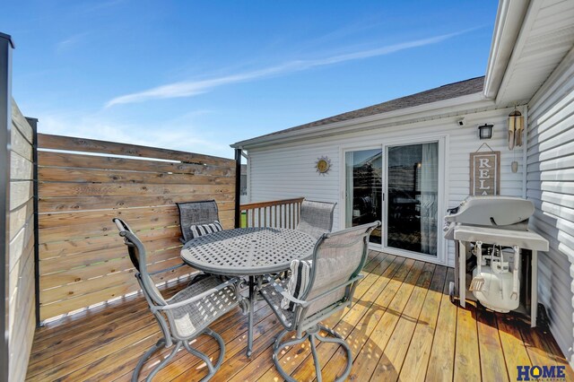 2222 SW Soukup Dr, Lincoln, NE 68522 - wooden deck with area for grilling and outdoor dining space