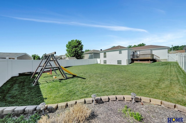 2222 SW Soukup Dr, Lincoln, NE 68522 - view of yard with a playground and a wooden deck