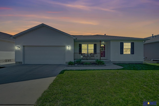 2222 SW Soukup Dr, Lincoln, NE 68522 - ranch-style house featuring covered porch, an attached garage, driveway, and a front lawn